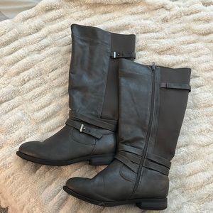 Grey faux leather boots.